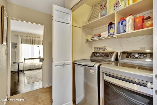 333 M St # 402, Anchorage, AK 99501 - laundry room featuring separate washer and dryer and light colored carpet