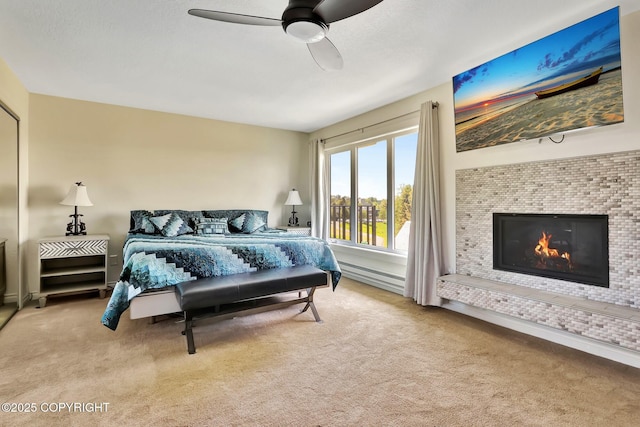 333 M St # 402, Anchorage, AK 99501 - carpeted bedroom with a fireplace and ceiling fan