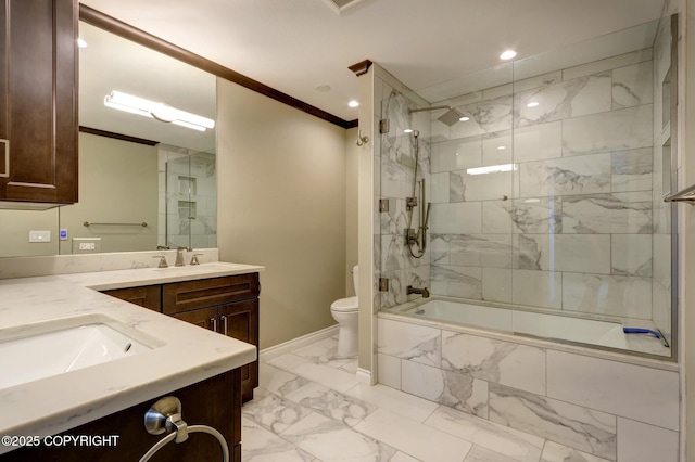 333 M St # 402, Anchorage, AK 99501 - bathroom featuring marble finish floors, ornamental molding, double vanity, baseboards, and toilet