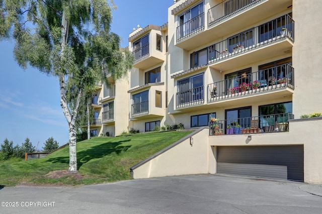333 M St # 402, Anchorage, AK 99501 - view of apartment building / complex with a garage and driveway