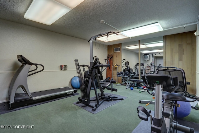 333 M St # 402, Anchorage, AK 99501 - workout area featuring a textured ceiling and carpet flooring