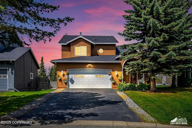 10201 Sextant Cir, Anchorage, AK 99515 - traditional-style home with asphalt driveway, a lawn, and a garage