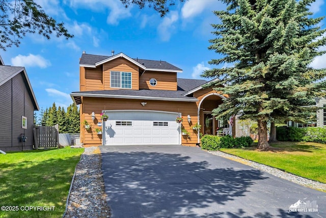 10201 Sextant Cir, Anchorage, AK 99515 - view of front facade featuring driveway and an attached garage