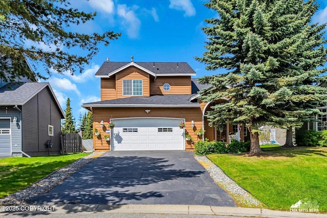 10201 Sextant Cir, Anchorage, AK 99515 - view of front of house featuring asphalt driveway, a garage, and a front yard