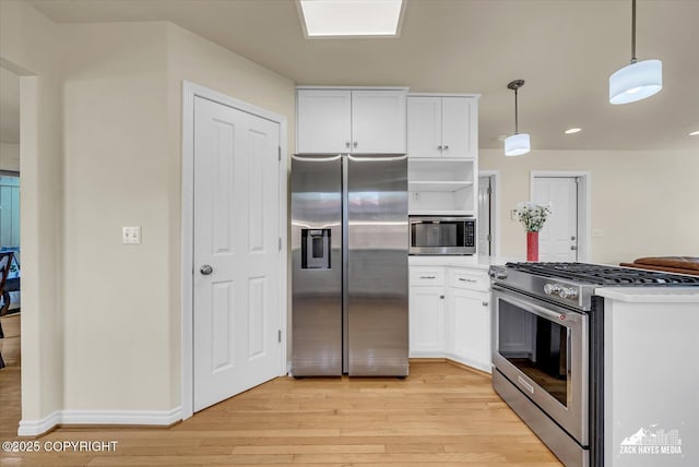 10201 Sextant Cir, Anchorage, AK 99515 - kitchen featuring appliances with stainless steel finishes, light wood-style floors, white cabinets, light countertops, and recessed lighting