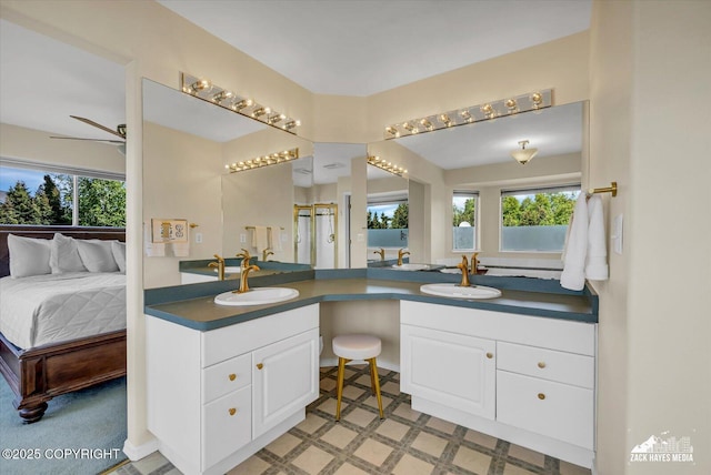 10201 Sextant Cir, Anchorage, AK 99515 - ensuite bathroom featuring vanity, plenty of natural light, and a ceiling fan
