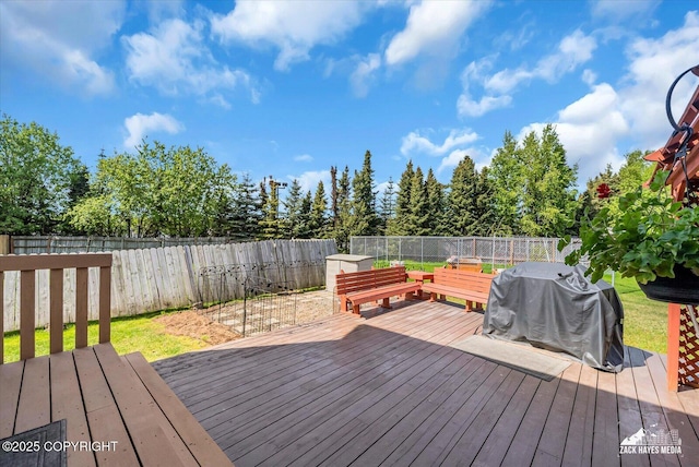 10201 Sextant Cir, Anchorage, AK 99515 - wooden terrace with a fenced backyard and area for grilling