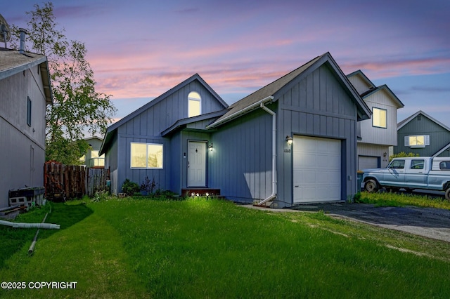 4160 Crannog St, Anchorage, AK 99502 - view of front of property featuring asphalt driveway, a garage, and board and batten siding