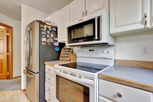 4160 Crannog St, Anchorage, AK 99502 - kitchen featuring stainless steel appliances, white cabinetry, light countertops, and light wood-type flooring