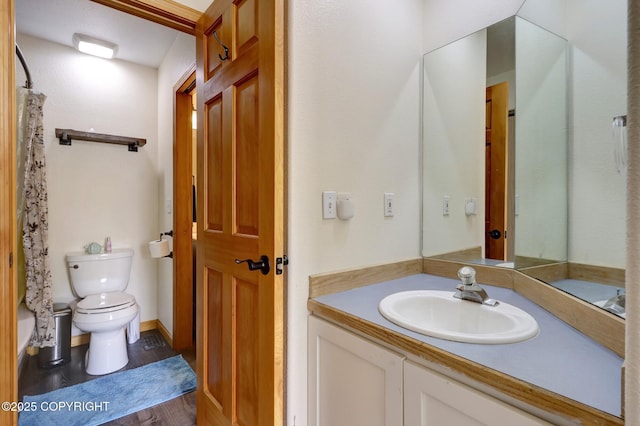 4160 Crannog St, Anchorage, AK 99502 - full bathroom with toilet, vanity, and wood finished floors