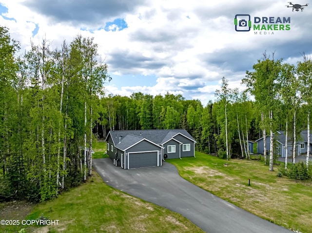 4124 N Coronado St, Wasilla, AK 99623 - view of front facade featuring an attached garage, a front yard, and driveway