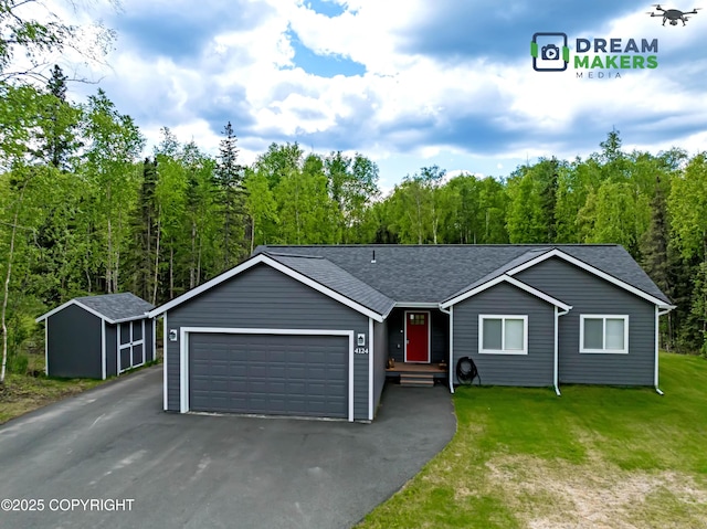 4124 N Coronado St, Wasilla, AK 99623 - ranch-style home featuring an attached garage, driveway, a front yard, and roof with shingles
