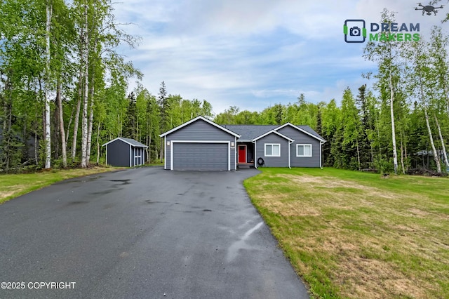 4124 N Coronado St, Wasilla, AK 99623 - ranch-style home with driveway, an attached garage, a front yard, and a storage shed