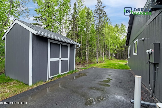 4124 N Coronado St, Wasilla, AK 99623 - view of parking / parking lot featuring a storage unit
