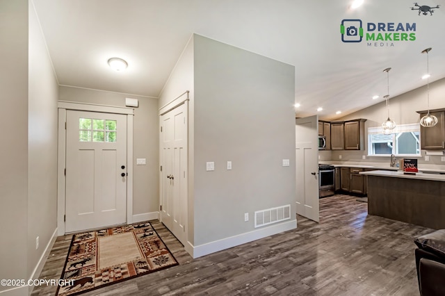 4124 N Coronado St, Wasilla, AK 99623 - entrance foyer featuring lofted ceiling, dark wood finished floors, and recessed lighting