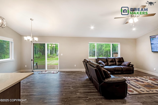 4124 N Coronado St, Wasilla, AK 99623 - living area featuring plenty of natural light, dark wood finished floors, vaulted ceiling, ceiling fan, and a chandelier