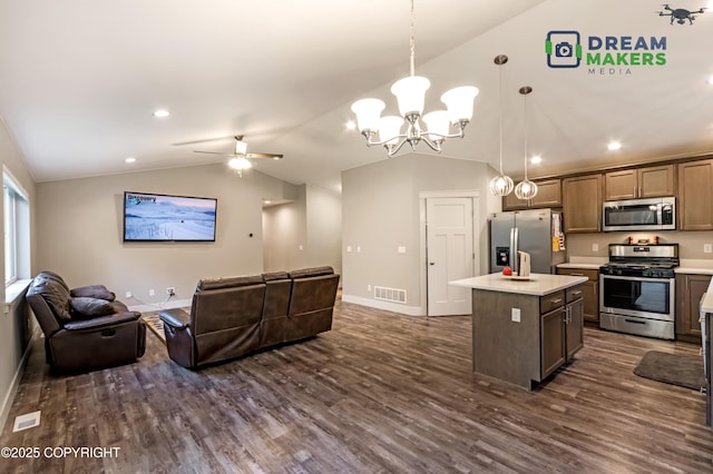 4124 N Coronado St, Wasilla, AK 99623 - living area with vaulted ceiling, dark wood-style floors, a chandelier, ceiling fan, and recessed lighting