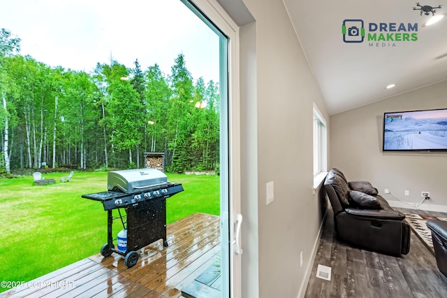 4124 N Coronado St, Wasilla, AK 99623 - doorway to outside with wood finished floors and vaulted ceiling