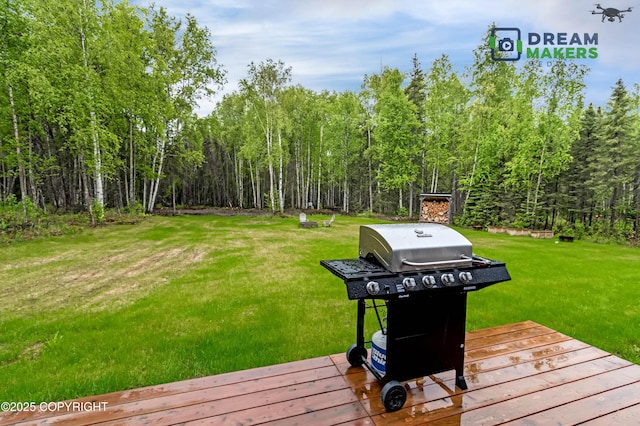 4124 N Coronado St, Wasilla, AK 99623 - wooden deck with area for grilling, a yard, and a wooded view