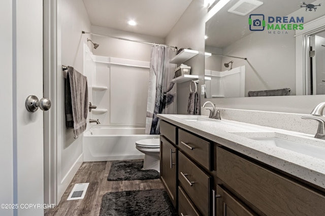 4124 N Coronado St, Wasilla, AK 99623 - bathroom with wood finished floors, shower / bath combo with shower curtain, and double vanity