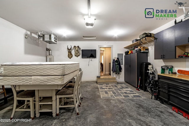 4124 N Coronado St, Wasilla, AK 99623 - garage featuring electric panel and a heating unit