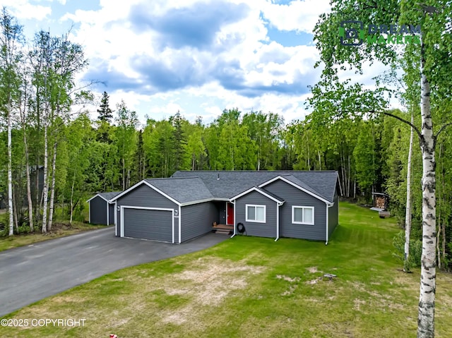 4124 N Coronado St, Wasilla, AK 99623 - view of front of home with a garage, a front yard, and asphalt driveway