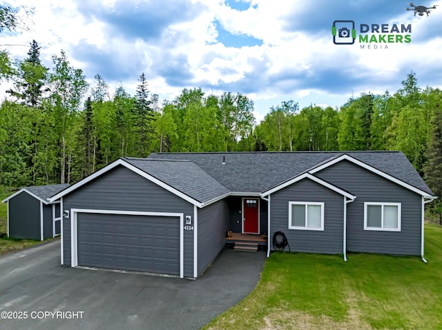 4124 N Coronado St, Wasilla, AK 99623 - ranch-style house featuring an attached garage, driveway, a shingled roof, and a front lawn