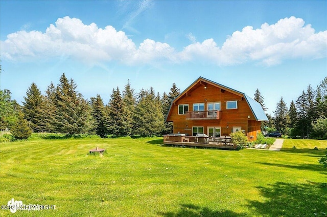 32879 Shorebird Ln, Anchor Point, AK 99556 - rear view of house featuring a balcony, a gambrel roof, a yard, and a deck