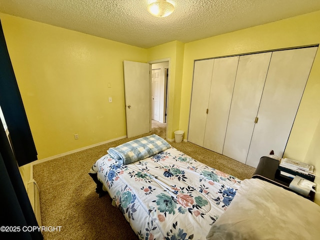 4941 E Rhubarb Cir, Wasilla, AK 99654 - carpeted bedroom with a closet and a textured ceiling