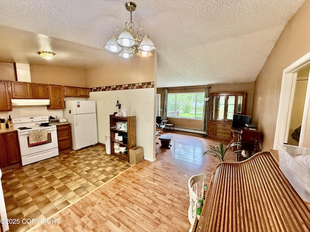 4941 E Rhubarb Cir, Wasilla, AK 99654 - kitchen with white appliances, under cabinet range hood, a textured ceiling, brown cabinets, and light countertops