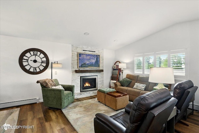 6911 Cheryl St, Anchorage, AK 99518 - living room with vaulted ceiling, wood finished floors, a stone fireplace, and a baseboard heating unit