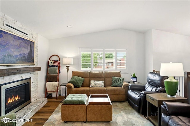 6911 Cheryl St, Anchorage, AK 99518 - living area with a fireplace, lofted ceiling, and wood finished floors