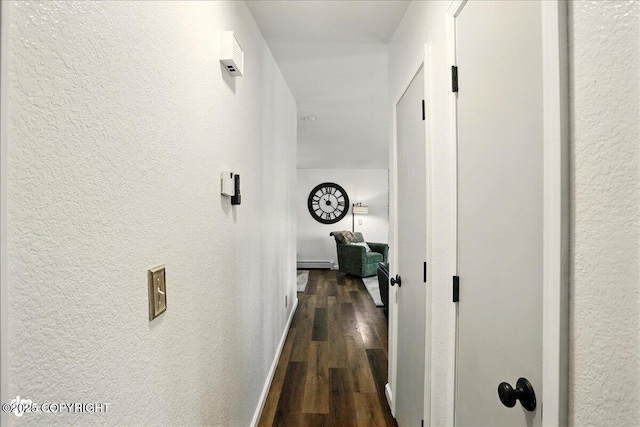 6911 Cheryl St, Anchorage, AK 99518 - corridor with a textured wall, dark wood-type flooring, and a baseboard radiator