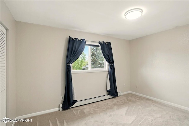 6911 Cheryl St, Anchorage, AK 99518 - spare room featuring light colored carpet, baseboards, and baseboard heating