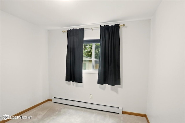 6911 Cheryl St, Anchorage, AK 99518 - spare room featuring baseboard heating, baseboards, and light carpet