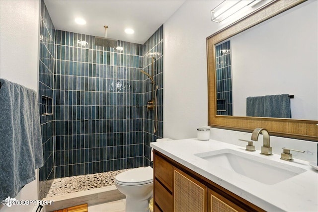 6911 Cheryl St, Anchorage, AK 99518 - bathroom featuring vanity, toilet, and a tile shower