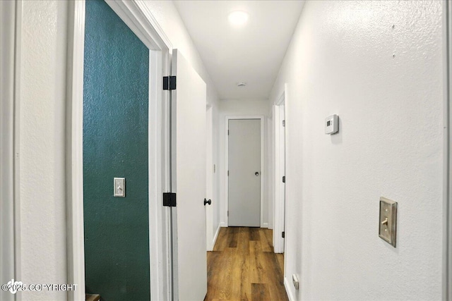 6911 Cheryl St, Anchorage, AK 99518 - corridor featuring wood finished floors