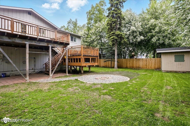 6911 Cheryl St, Anchorage, AK 99518 - view of yard featuring a deck, stairway, and a patio area