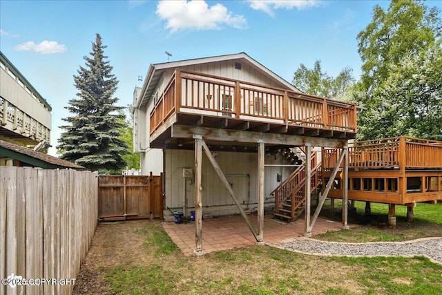 6911 Cheryl St, Anchorage, AK 99518 - rear view of house with a deck, a patio area, and stairs