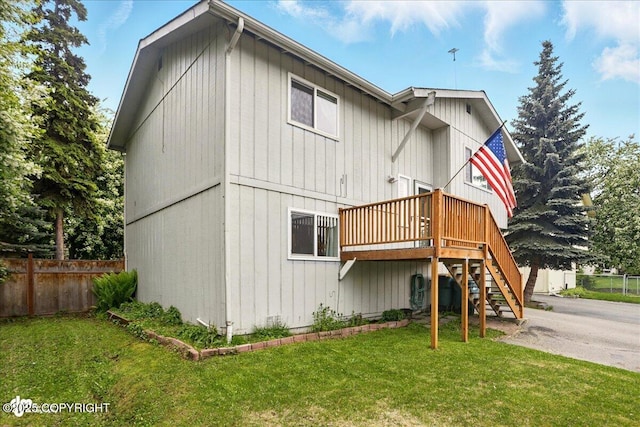 6911 Cheryl St, Anchorage, AK 99518 - rear view of property featuring stairway and a wooden deck