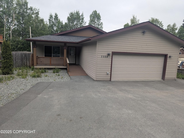 7324 Zurich St, Anchorage, AK 99507 - ranch-style home featuring driveway, a porch, and an attached garage