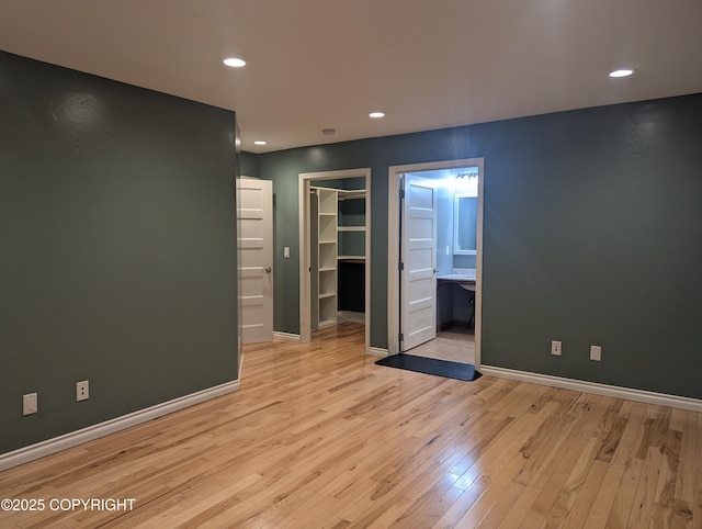 7324 Zurich St, Anchorage, AK 99507 - spare room featuring light wood-style floors, baseboards, and recessed lighting