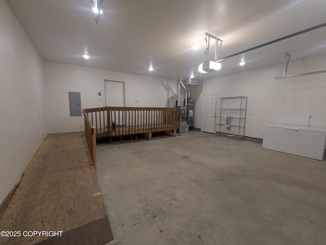 7324 Zurich St, Anchorage, AK 99507 - garage featuring electric panel, a garage door opener, heating unit, and secured water heater