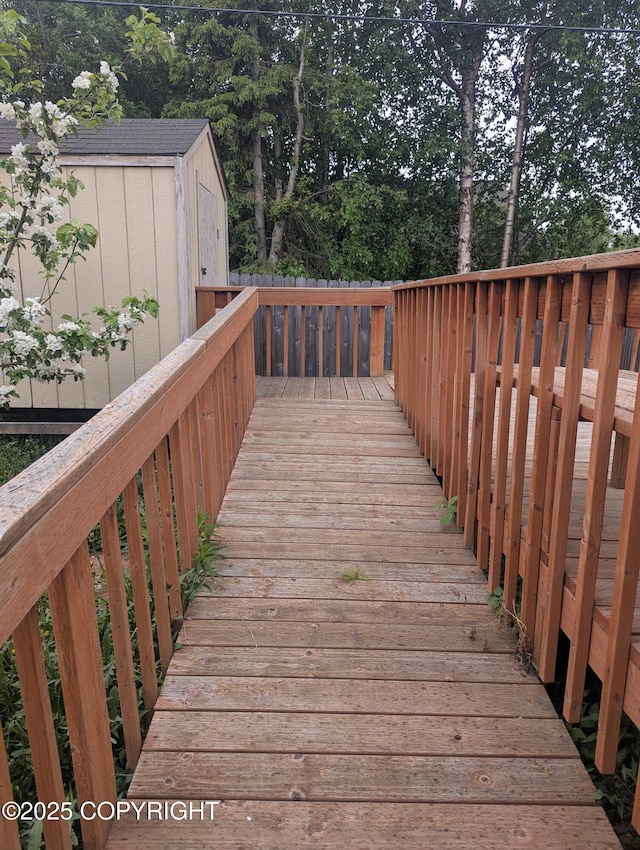 7324 Zurich St, Anchorage, AK 99507 - wooden deck with view of scattered trees