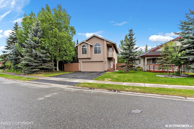 2353 Maritime Loop, Anchorage, AK 99515 - view of front facade with asphalt driveway, an attached garage, and a front lawn