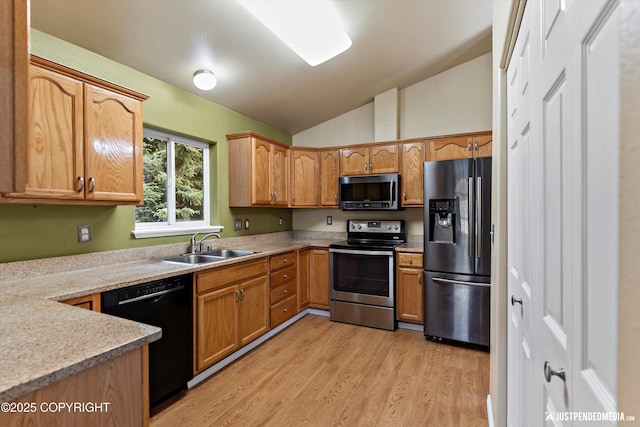 2353 Maritime Loop, Anchorage, AK 99515 - kitchen with appliances with stainless steel finishes, vaulted ceiling, a sink, light wood finished floors, and light countertops