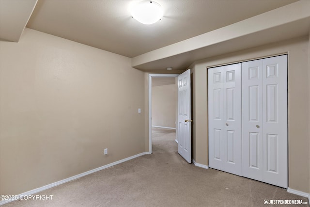 2353 Maritime Loop, Anchorage, AK 99515 - unfurnished bedroom featuring light colored carpet, baseboards, and a closet