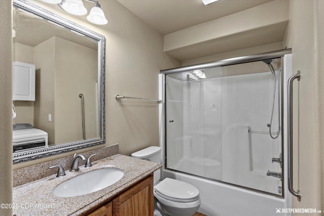 2353 Maritime Loop, Anchorage, AK 99515 - bathroom featuring toilet, vanity, and combined bath / shower with glass door