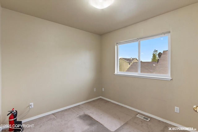 2353 Maritime Loop, Anchorage, AK 99515 - carpeted spare room featuring baseboards