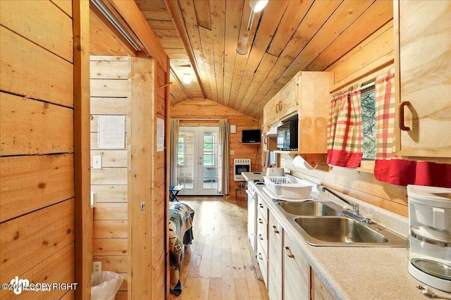 13364 Sterling Hwy, Ninilchik, AK 99639 - kitchen featuring wood walls, lofted ceiling, wooden ceiling, a sink, and light wood-style floors